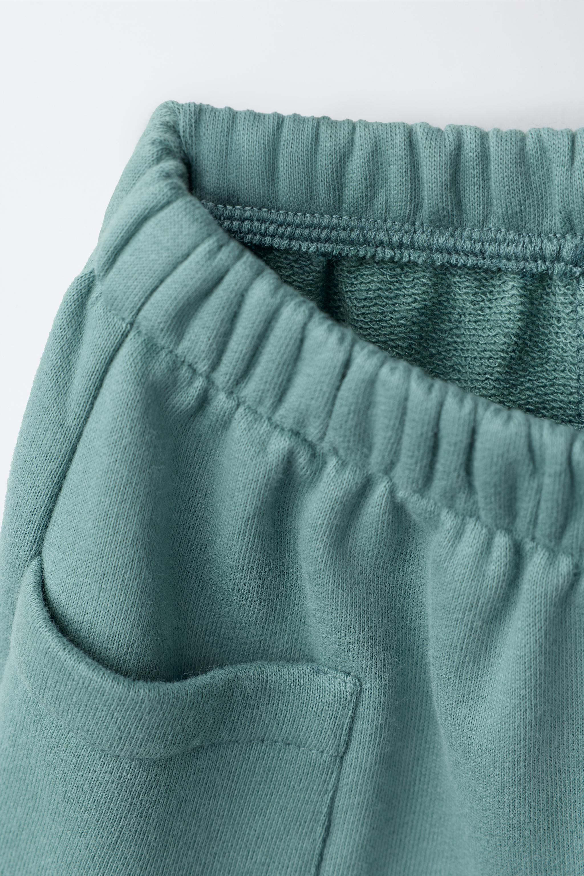 DUCK LABEL WIDE LEG FLEECE PANTS